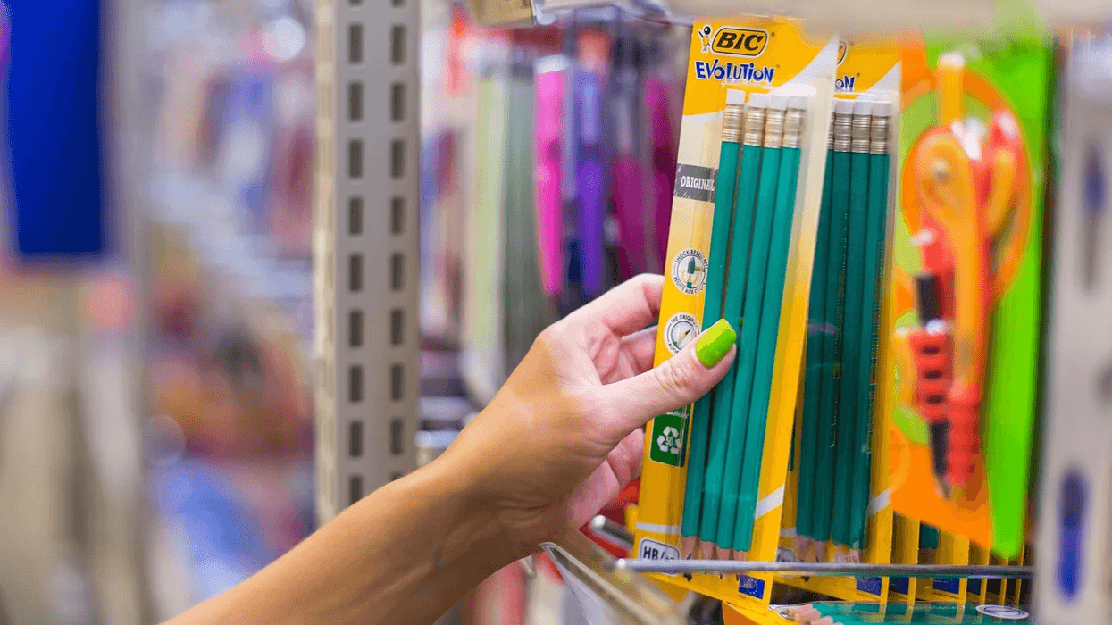 10 money-saving tips for back to school season woman grabbing pencils at a store
