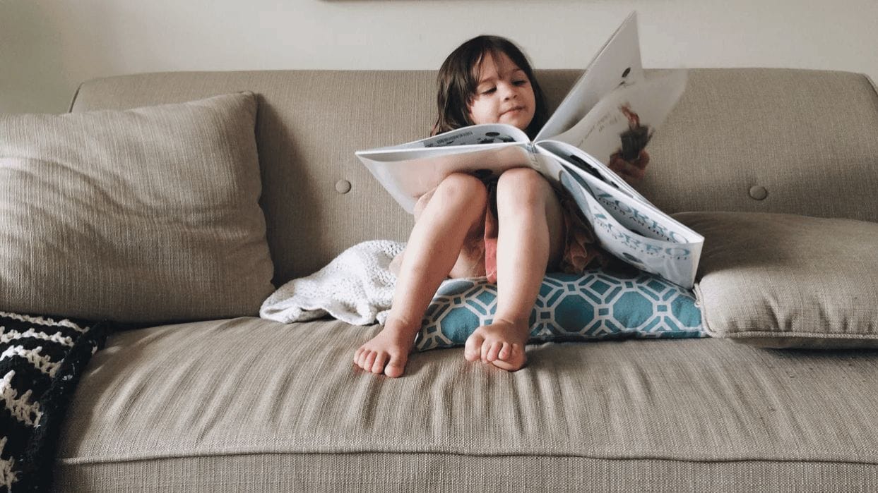 It’s science: Reading the same books to your child over and over makes them smarter child reading a book- reading the same books to your child