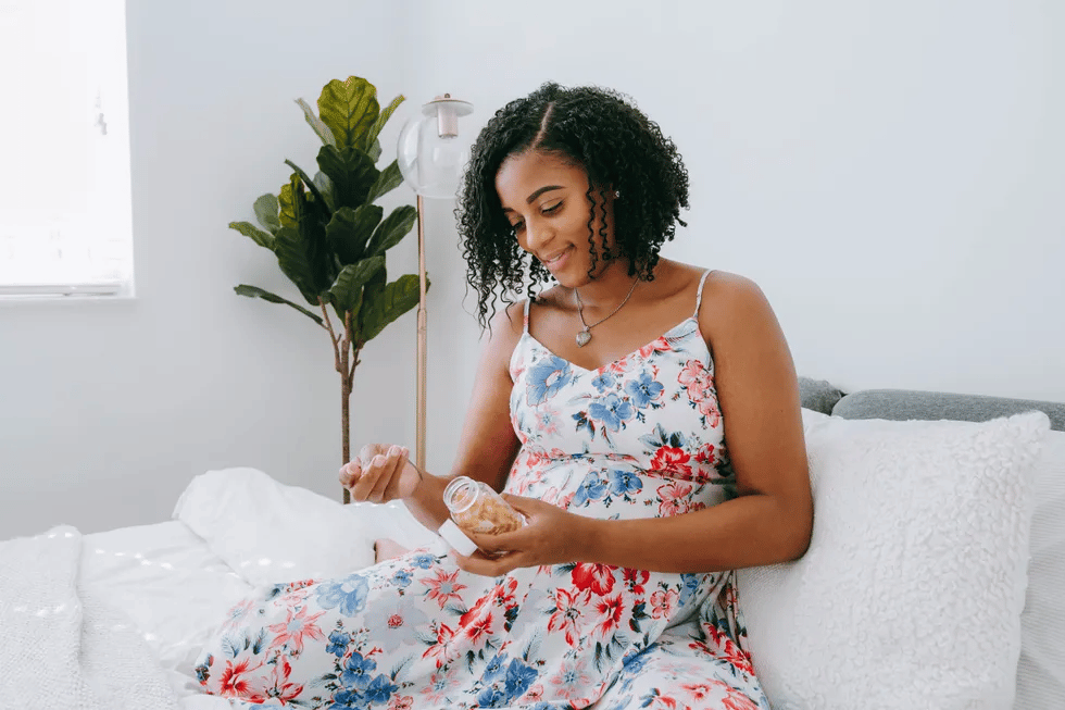 Which supplements should I take to increase fertility? woman-sitting-on-couch-ferility-supplements