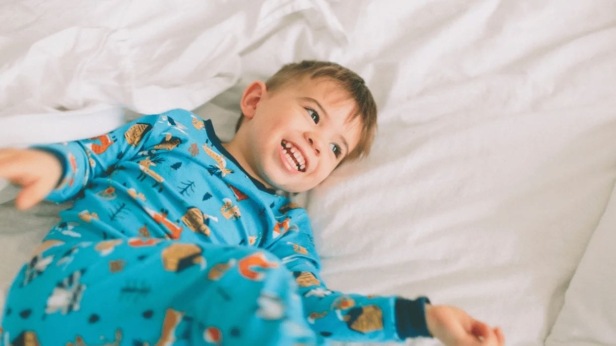 This is the biggest indicator of a kid’s happiness, according to survey little boy playing in a bed