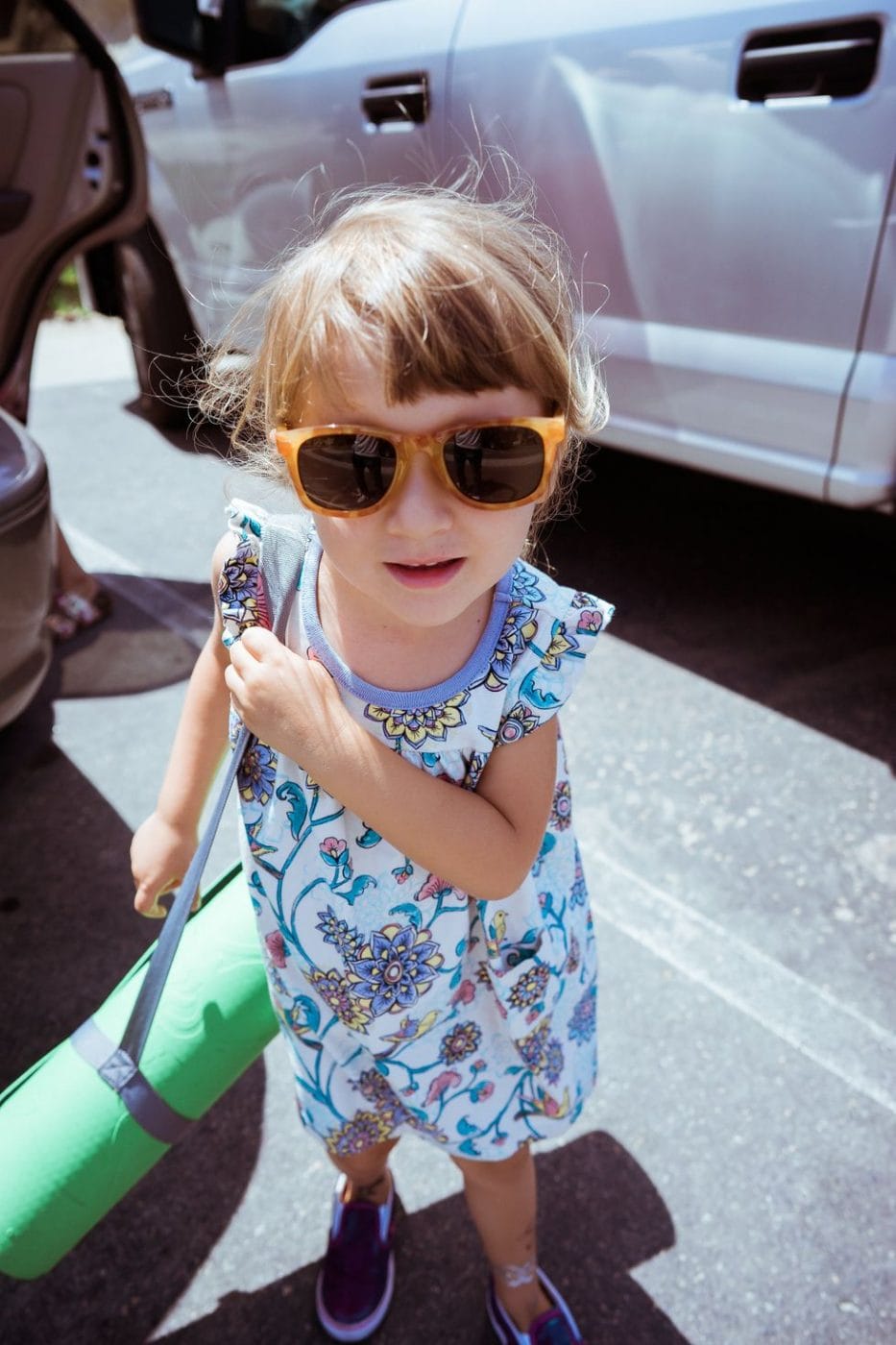 Mamaste—7 fun, easy yoga poses to add to your day with your little ones child wearing sunglasses