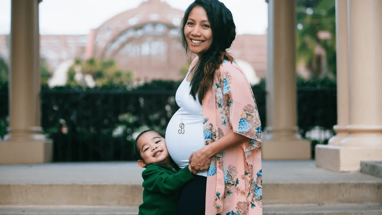 What’s the ‘right’ amount of time between pregnancies? It might be shorter than you think Pregnant mom hugging a toddler