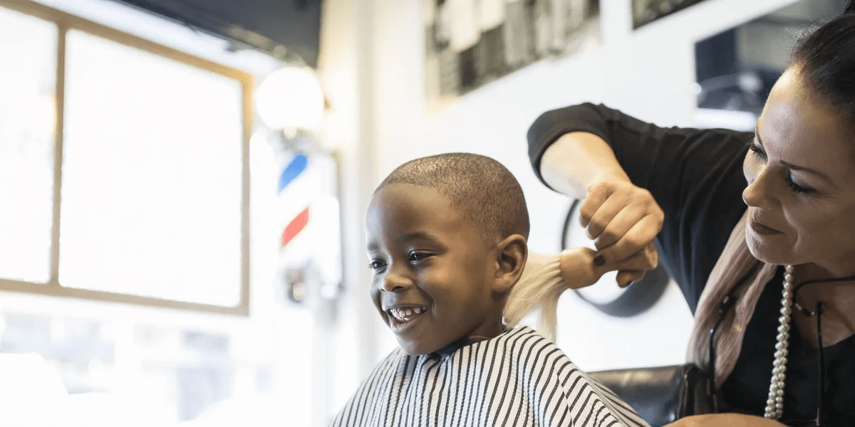 15 stylish back-to-school hairstyles for kids kid-getting-haircut-in-barber-chair