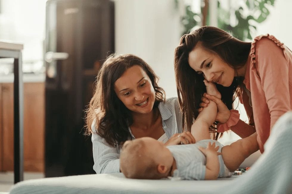 A primer on legal basics for forming LGBTQ families lgbtq family with baby at home - lgbtq family building