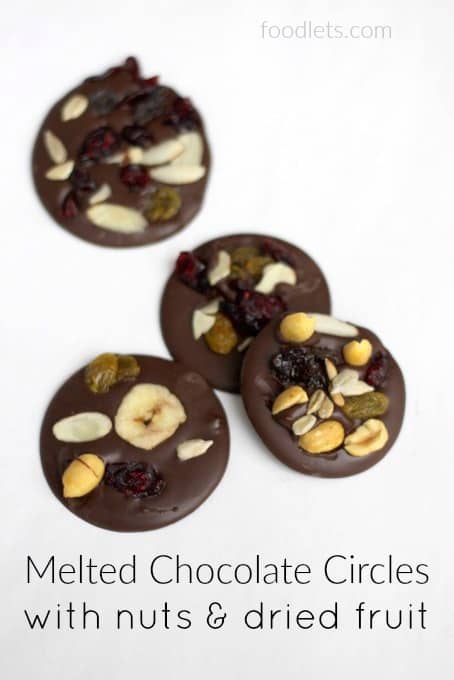 melted chocolate circles with nuts dried fruit - Motherly
