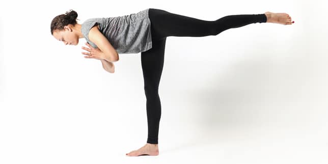 Postpartum Exercise Plan: 5 Exercises to Build a Strong Fitness Routine woman doing yoga