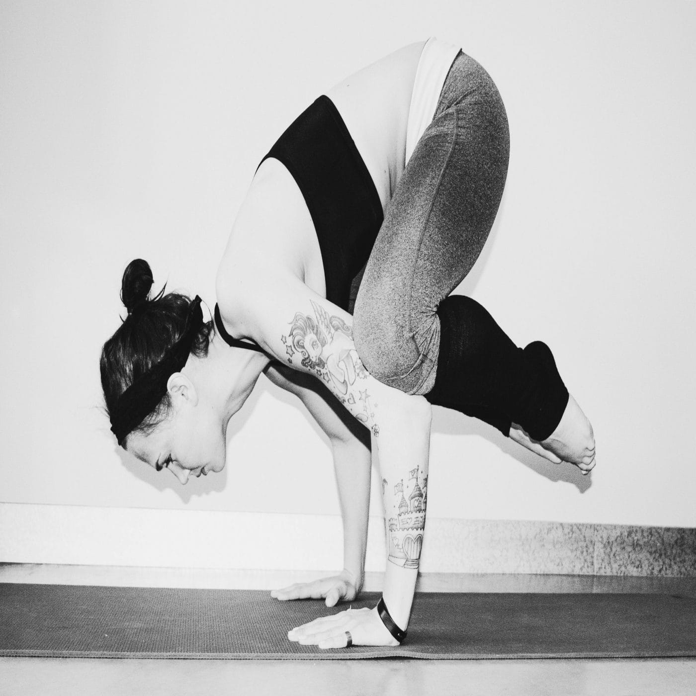 How to include your little one into your yoga practice—8 mommy + me poses woman in a yoga pose