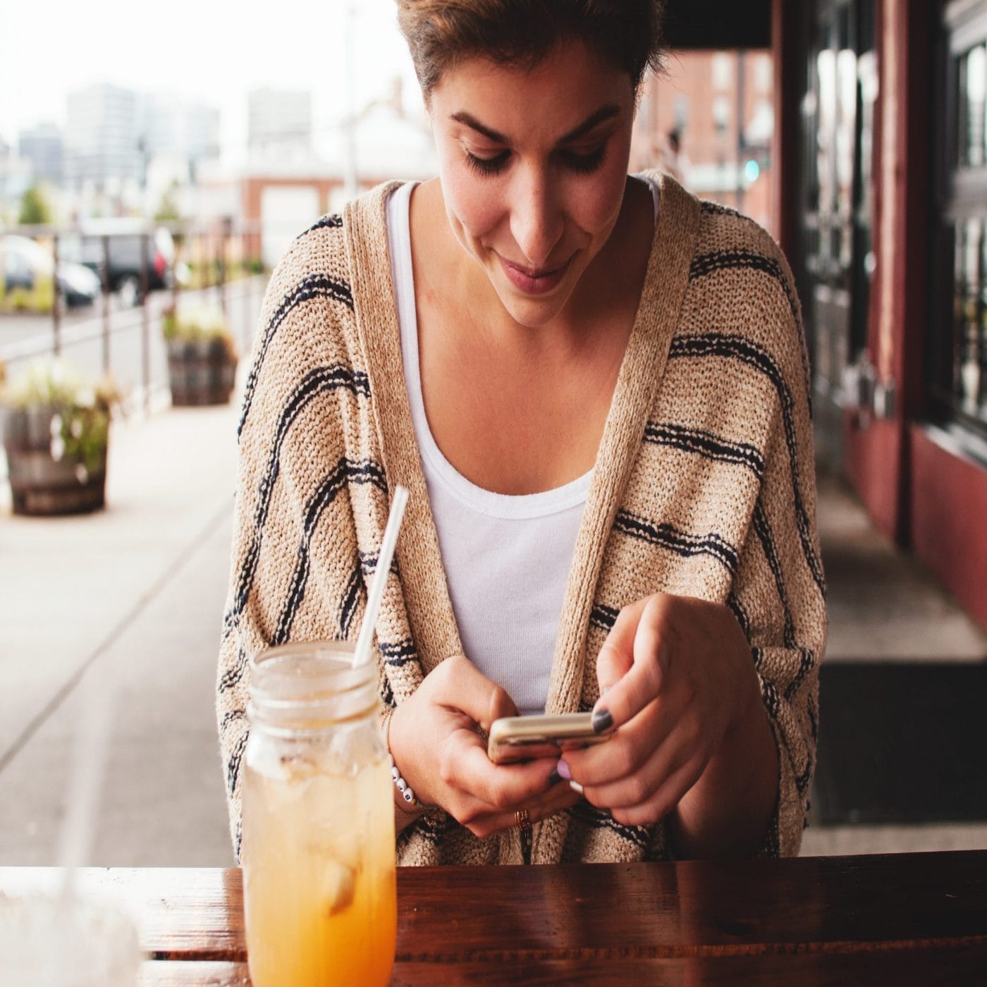 Why we heart ? Snapchat + awesome mamas to follow right now woman on cell phone sitting down