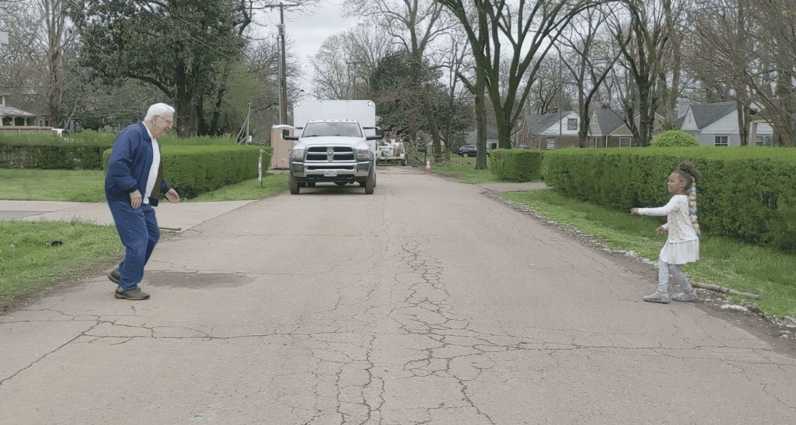 This grandpa & granddaughter are going viral for their incredibly joyful socially distant dance-off grandpa and granddaughter dancing in the road
