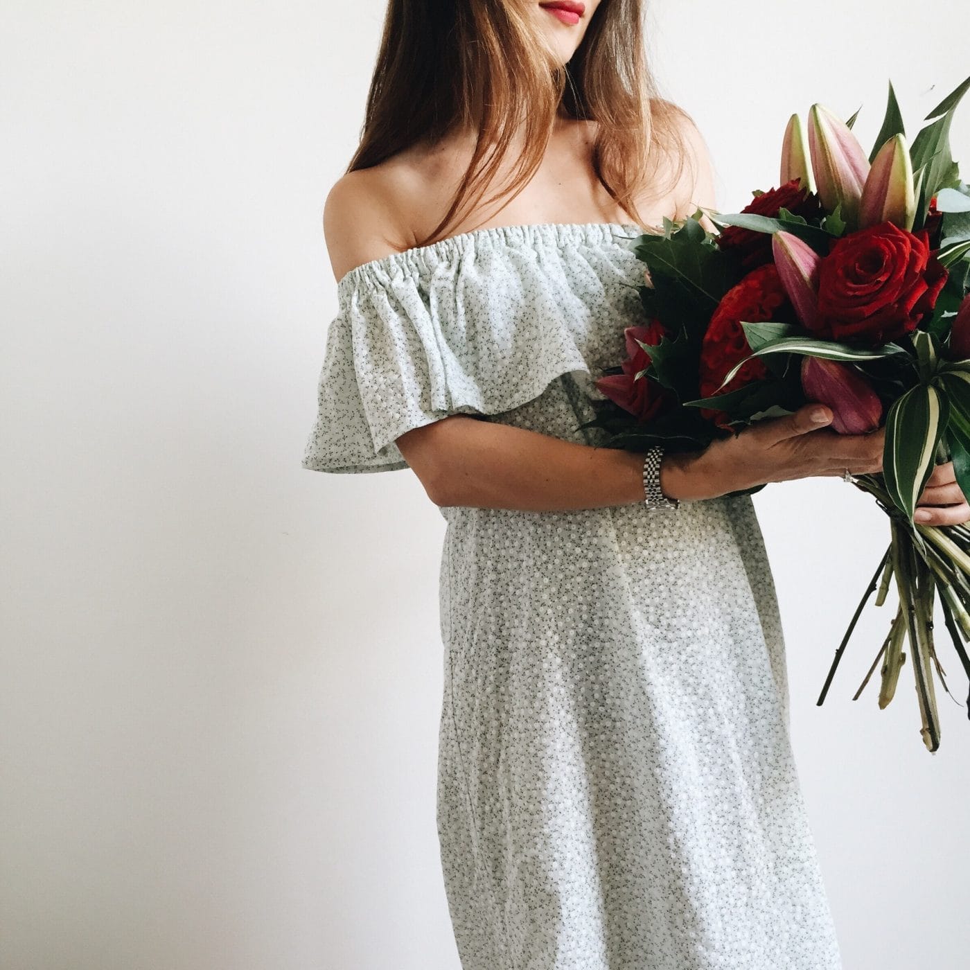 The two self-care questions that can help mamas recharge woman holding bouquet of flowers - self-care questions