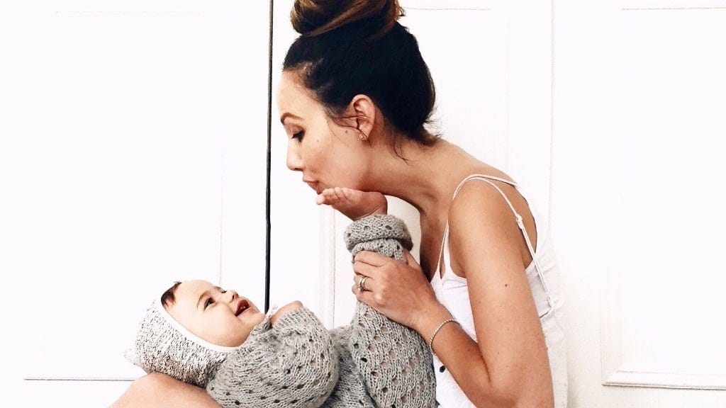Now the fun really begins: How to play with your curious 8-month-old mom kissing baby feet