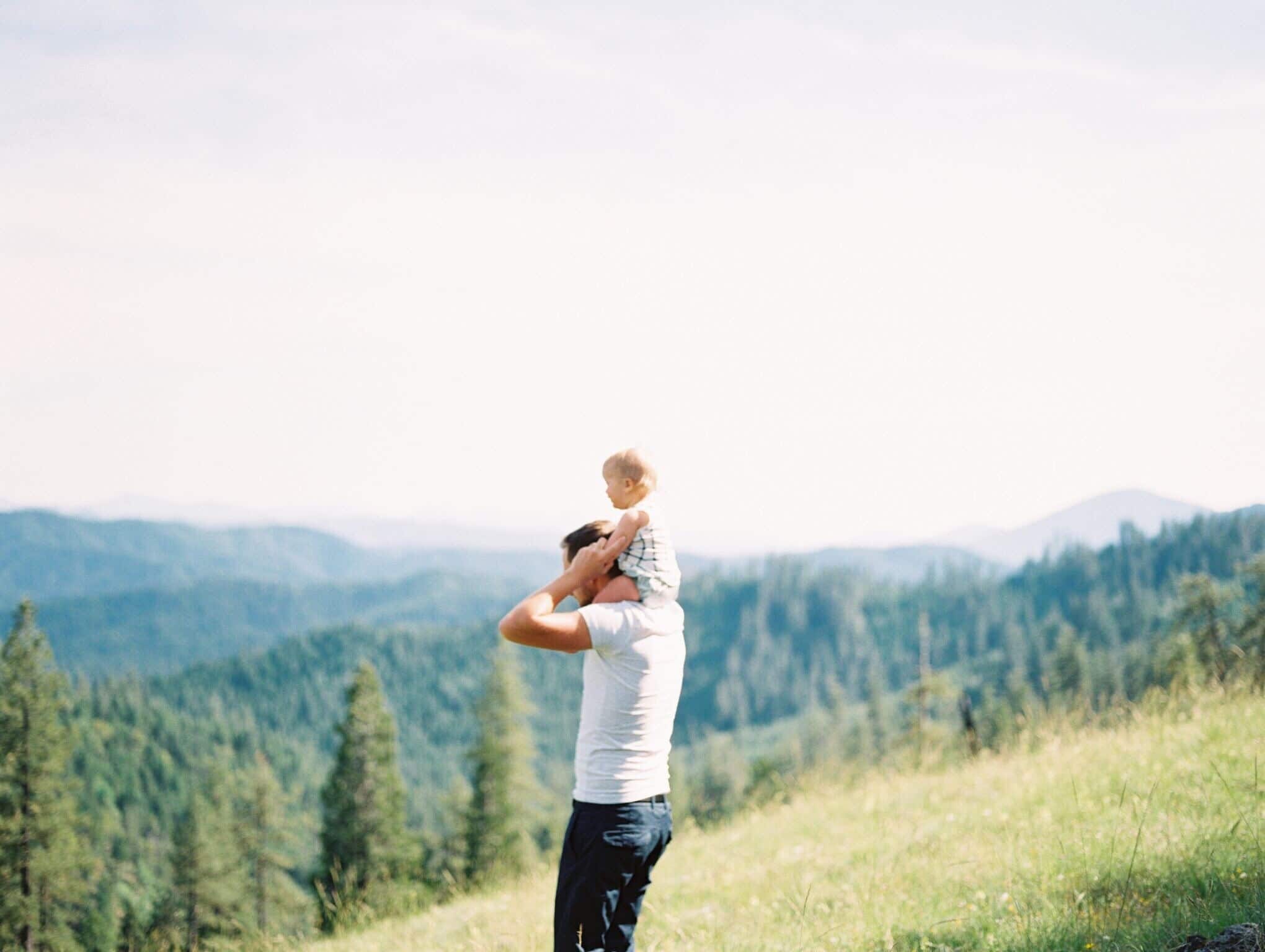 Becoming brilliant: The 6 essential skills children need to become successful adults dad with child on his shoulders in a meadow