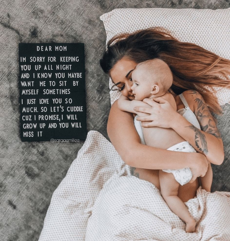 This viral post about baby only wanting mama has us đ mom holding baby next to a letter board sign