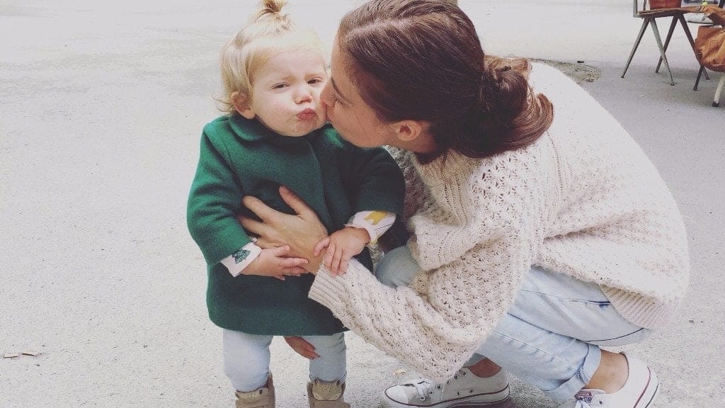 The 10 biggest misconceptions about stay-at-home moms mom kissing little girl on the cheek
