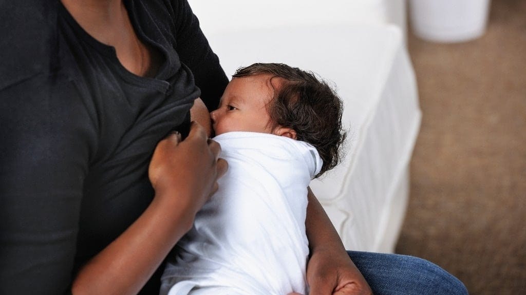 7 strategies to survive unpaid maternity leave mom breastfeeding newborn baby
