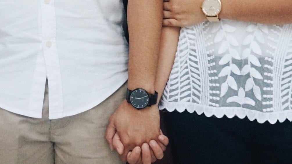 What partners should know: the first trimester couple holding hands