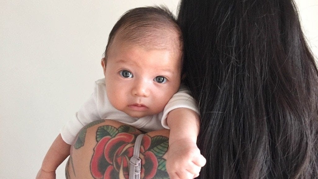 ‘When does motherhood get easier?’ mom holding baby over her shoulder