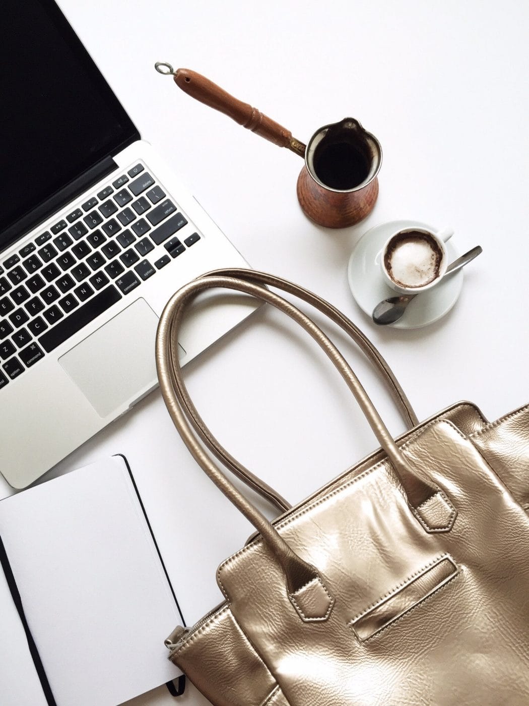 Your big work dilemmas—solved when you’re TTC or newly pregnant purse and coffee next to a laptop