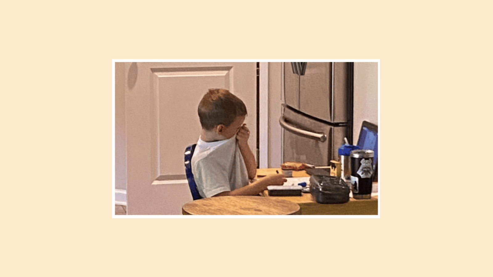 This viral photo of a kindergartener crying at virtual school is the reality for so many kids right now little boy crying over virtual school