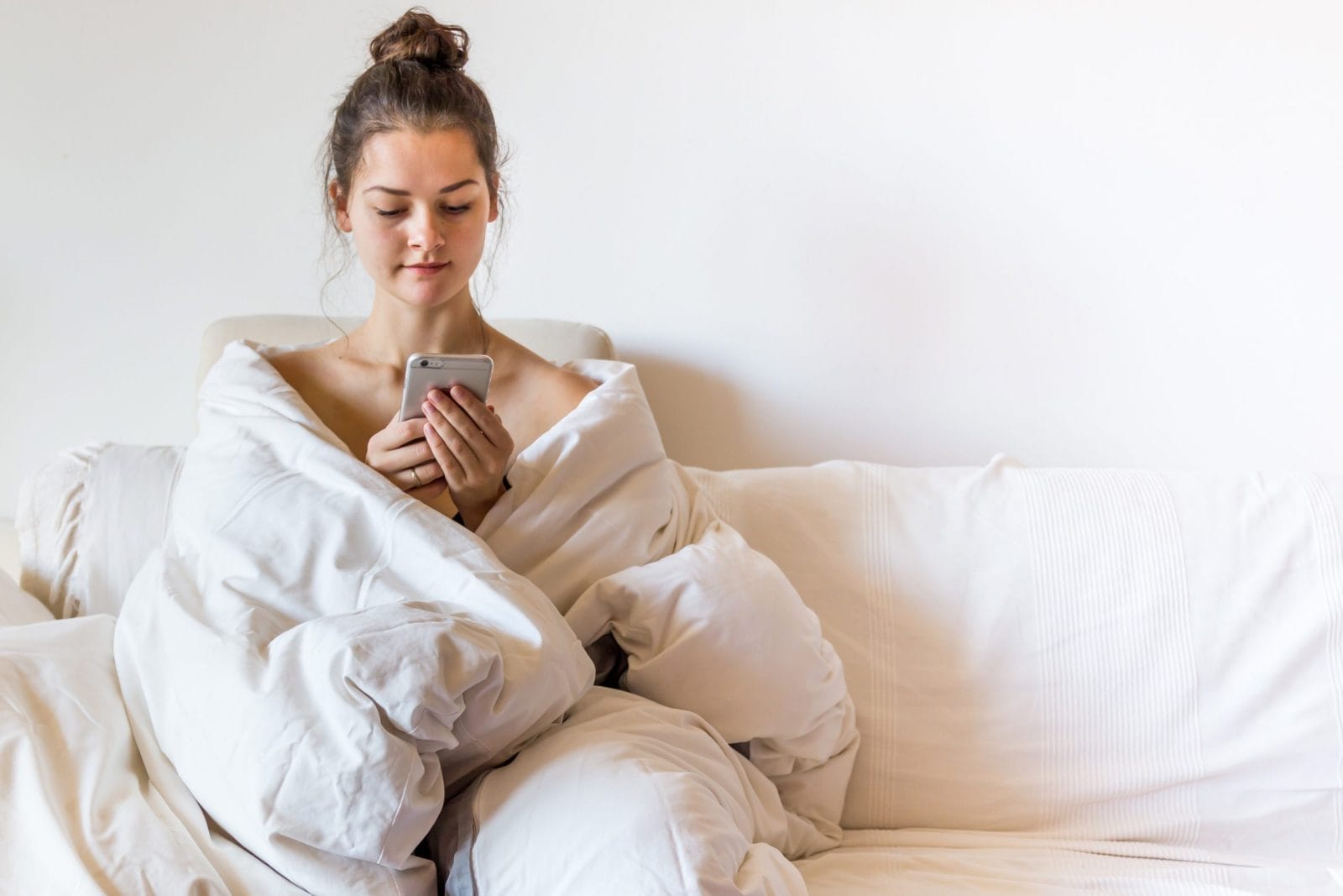 To the overwhelmed mothers: It’s going to be okay woman wearing a robe on her phone