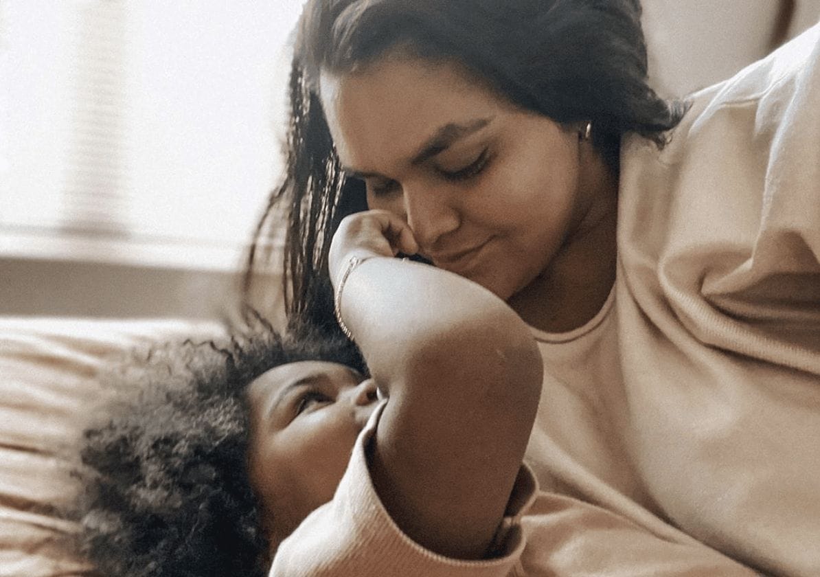 Indigenous motherhood is doing some of the hardest emotional labor we will ever have to do in our lives mom looking down at child- indigenous motherhood