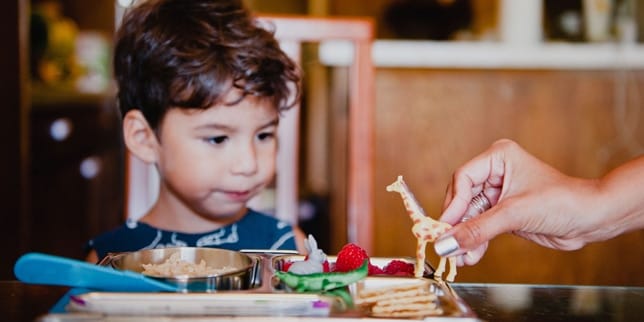 How to Prep (Yourself) for the First Day of School small boy playing with giraffe figurine