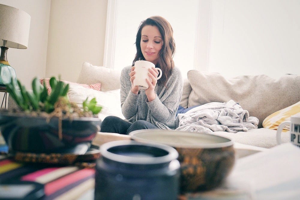 5 ways to eke out more time for yourself—because you deserve it Michelle Brandriss holding a cup of coffee