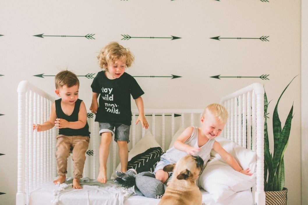 Here’s the truth: Being a parent to young children is HARD kids playing on a toddler bed