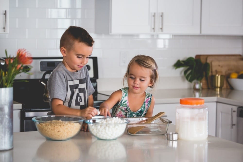 Chores, teamwork and high expectations: The 15 habits that raise responsible kids kids baking in the kitchen