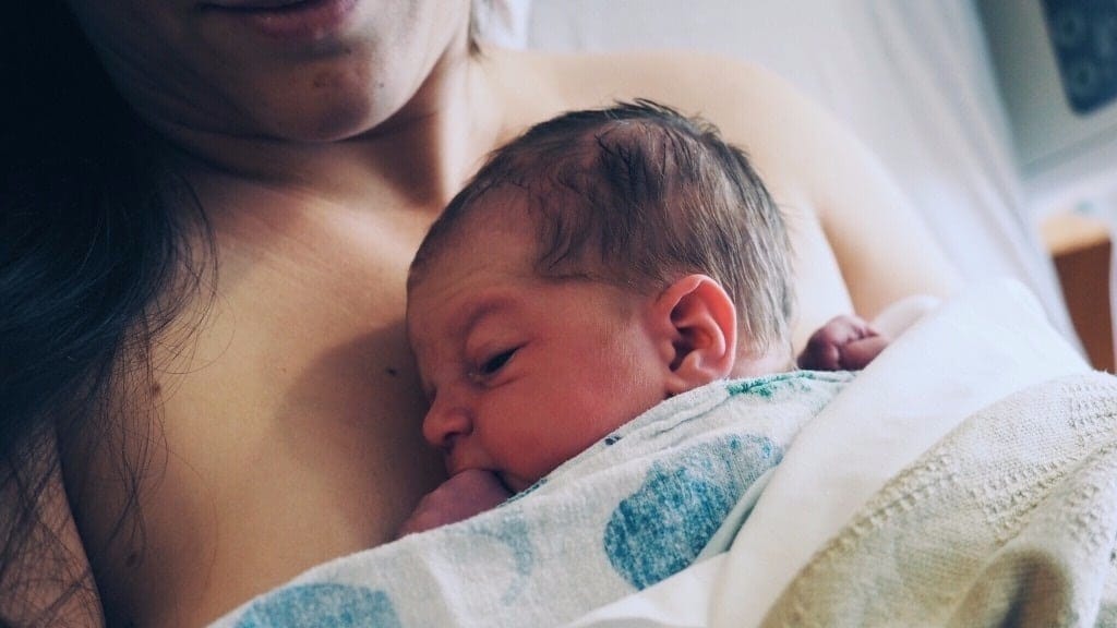As I hold my newborn, I realize: I will never get this moment back