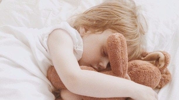A simple solution to your child’s night terrors little girl sleeping with a stuffed animal