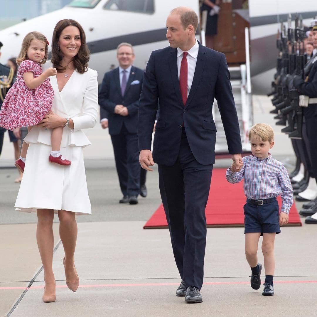 Pregnant Kate Middleton on raising a child—‘it takes a whole community’ kate middleton and family walking on tarmac