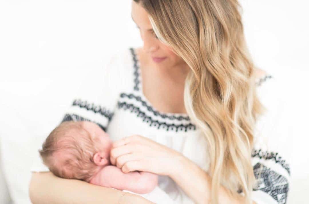 Whitney Port opens up about the reality of raising a son after losing her dad whitney port holding child