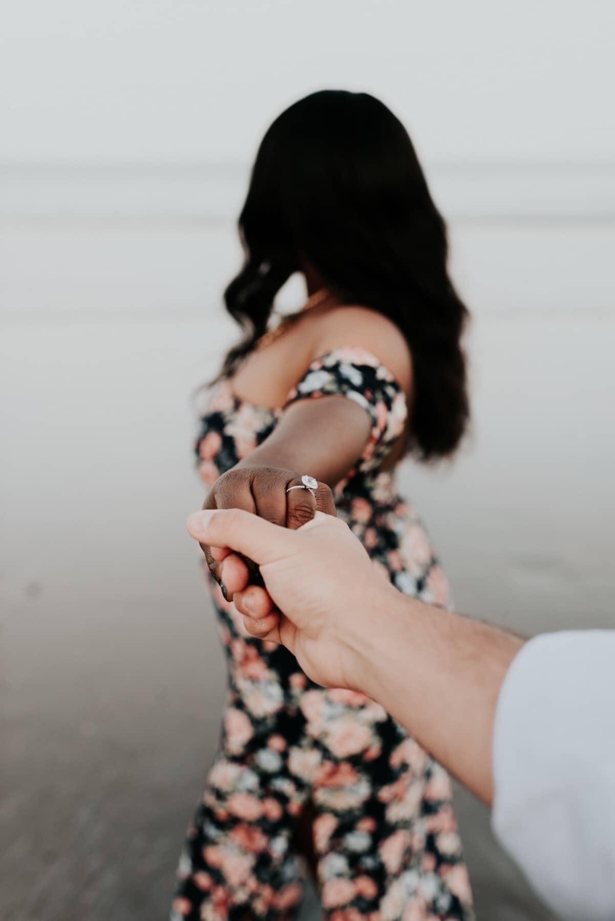 Sometimes marriage is just hard guy holding womans hand wearing an engagement ring