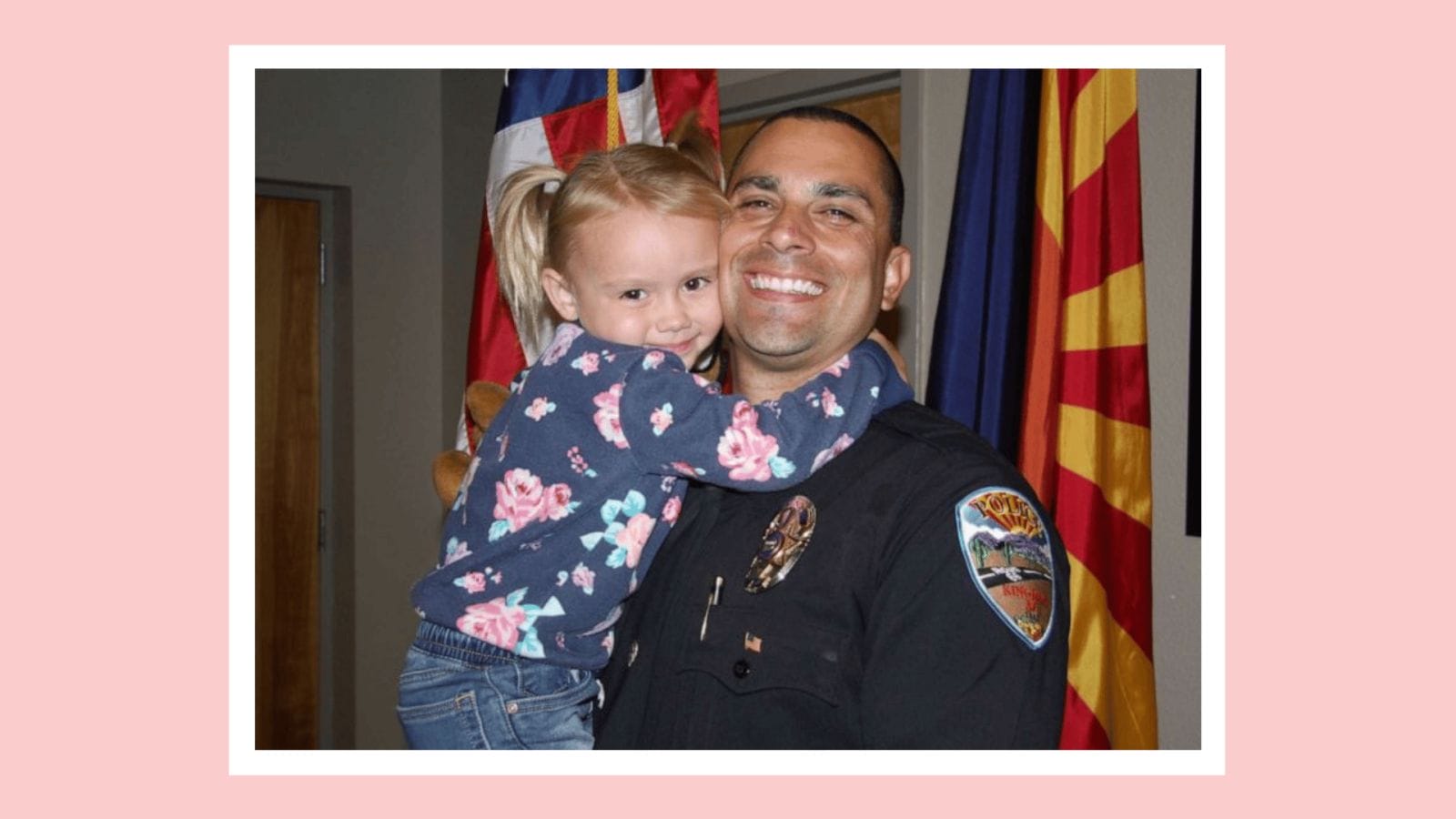 Police officer adopts child he met on duty Lieutenant Brian Zach holding adopted daughter