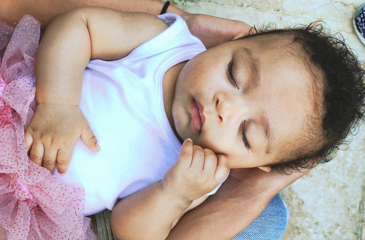 Serena Williams asked for teething tips for her 3-month-old—and moms of the internet delivered woman holding baby in lap