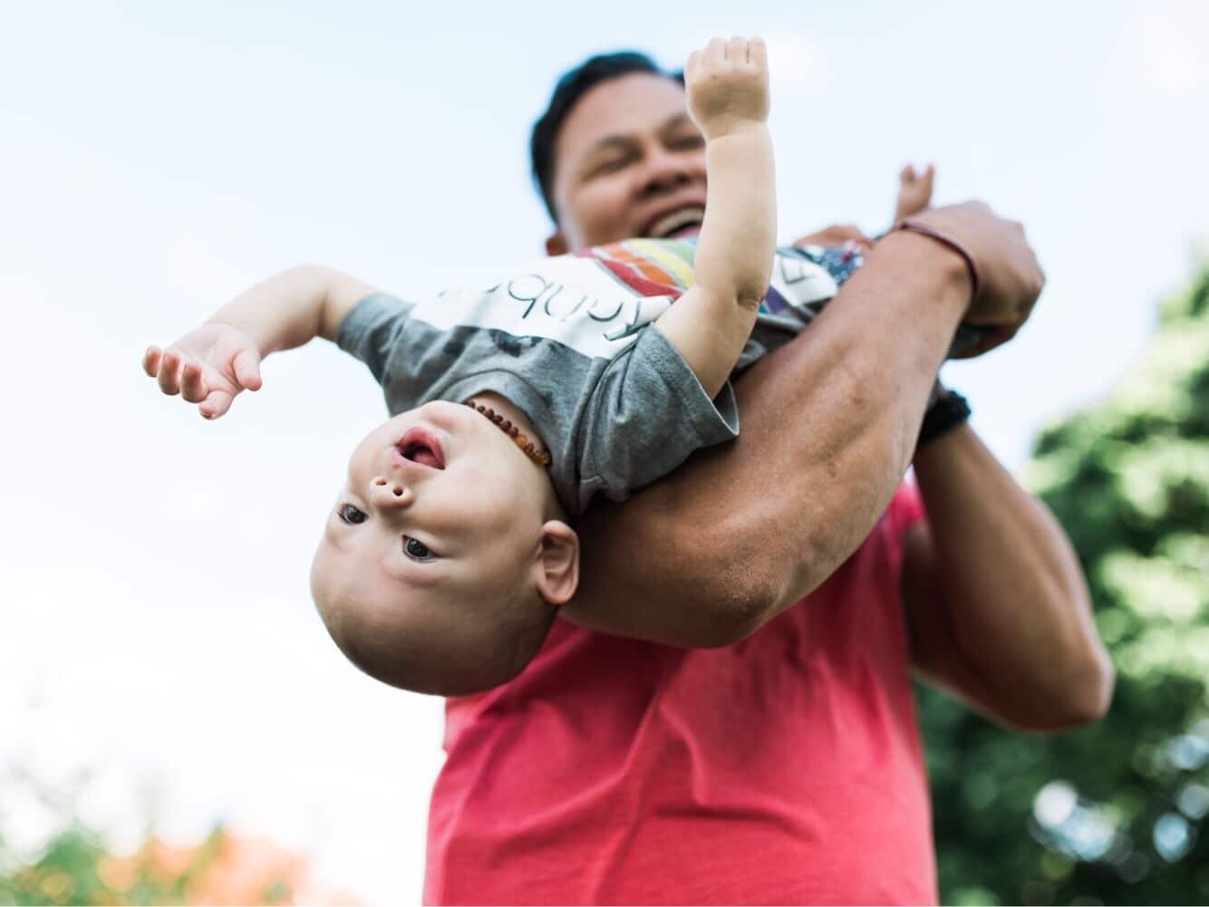 It’s OK to let your partner be their own parent Dad plays with child - It’s OK to let your partner be their own parent