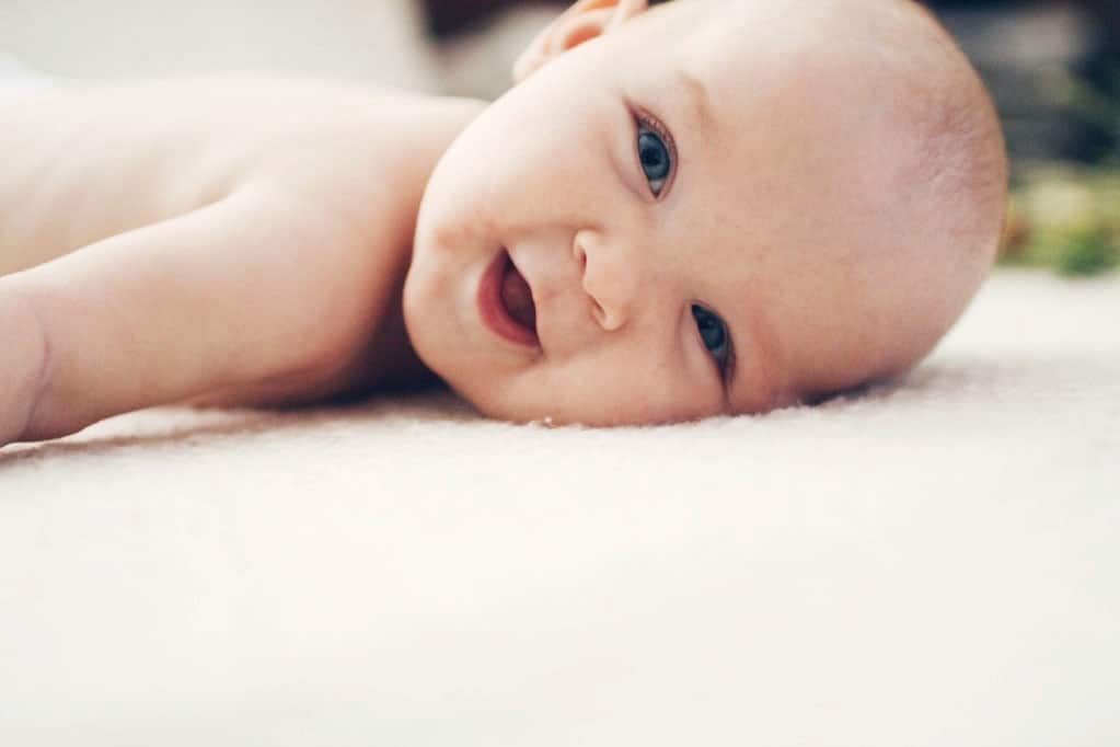 An ode to the not-so-new newborn newborn baby laying on the floor