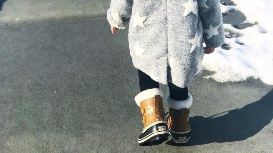11 winter boots that might keep your toddler outside longer than five minutes toddler wearing toddler snow boots