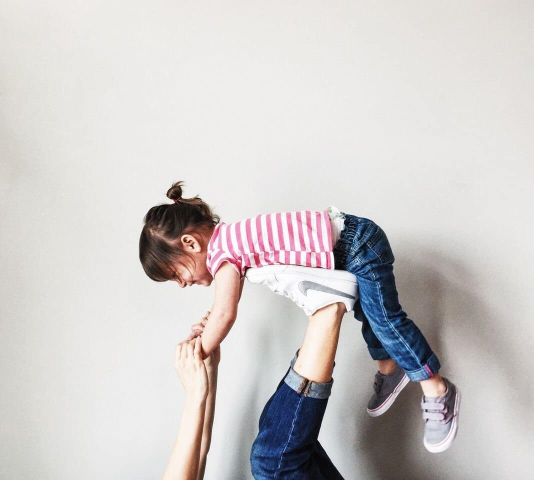 You know you’re a toddler mom when… mom playing airplane with little girl