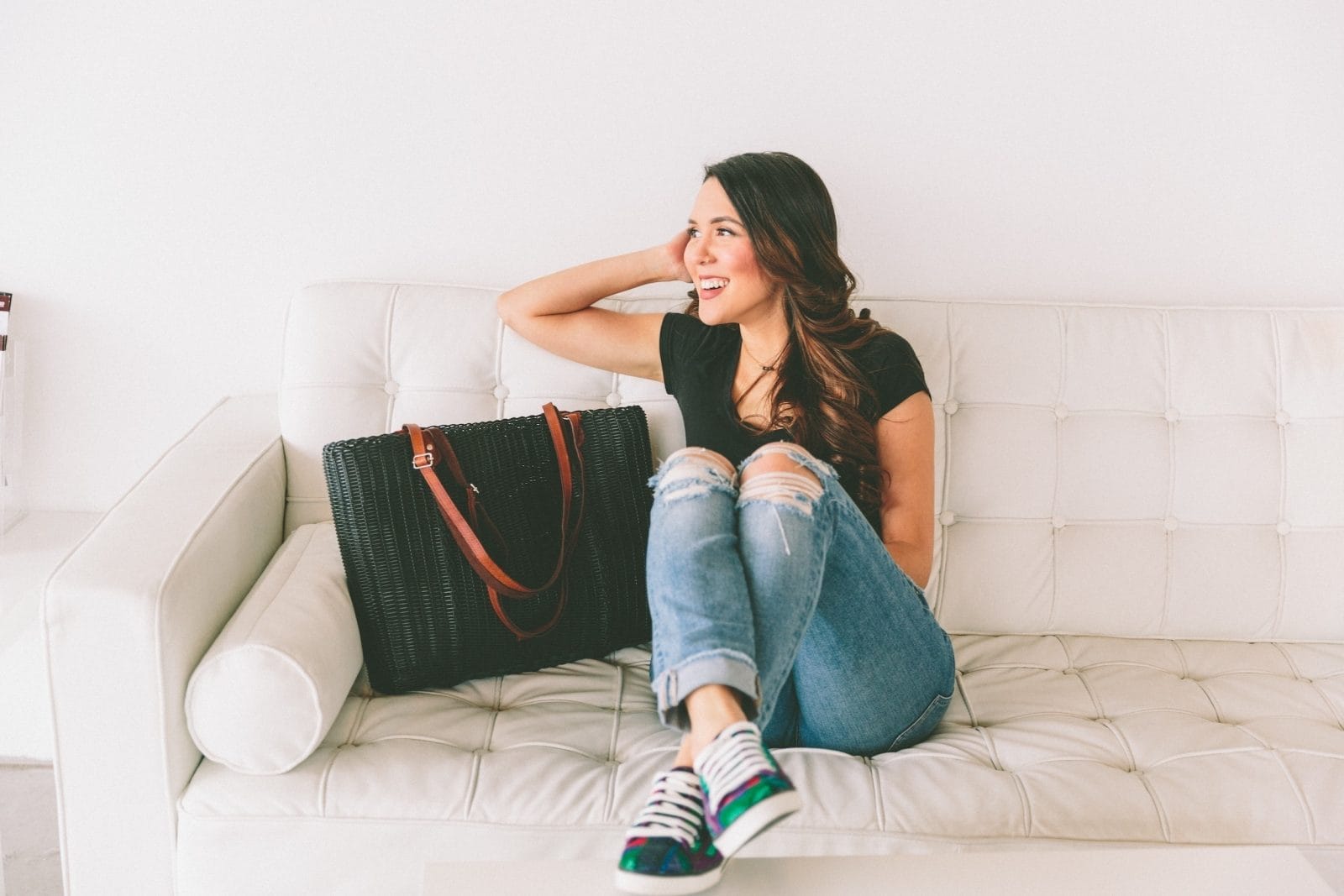 You were someone before you were their mom—and she still matters woman sitting on a couch next to purse