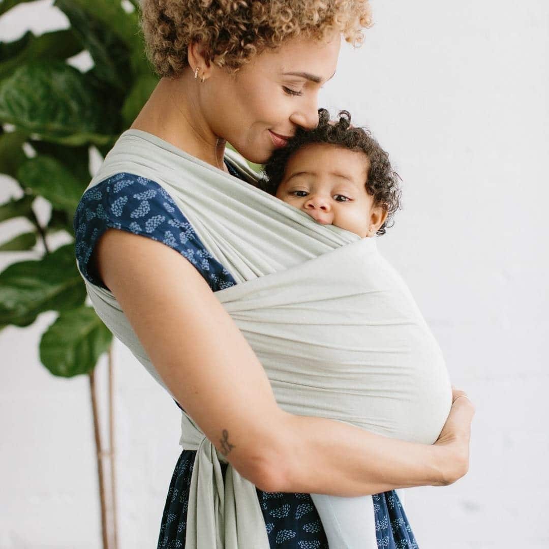 10 ways babywearing benefits both mothers and babies mom wearing baby in a baby carrier