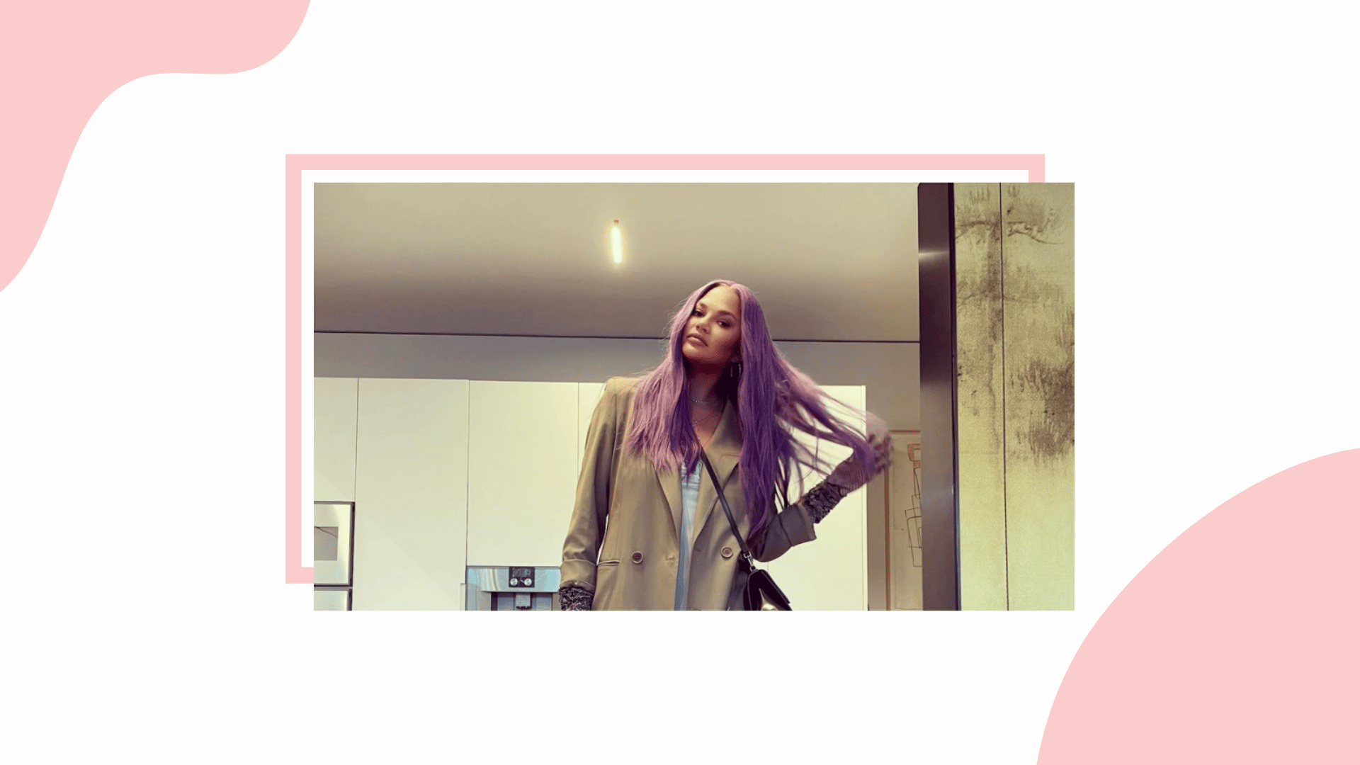 Chrissy Teigen rocking pink hair