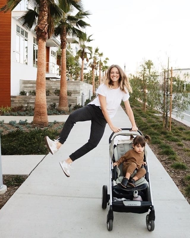 Mama milestones: 7 significant times you should step back and celebrate mother jumping beside her stroller, celebrating her mama milestones
