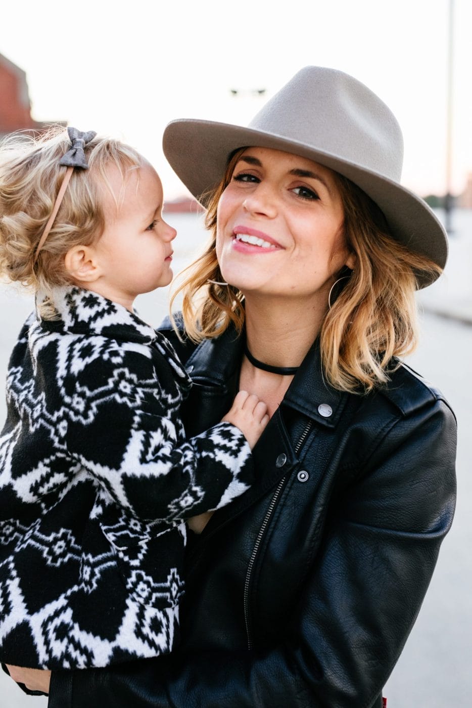 I took CBD and it made me a more present, less anxious mom mom holding daughter