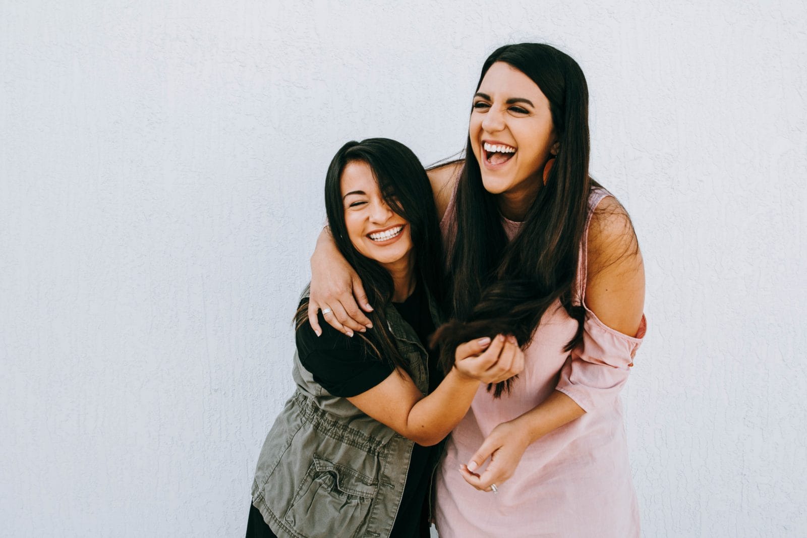 Motherhood is: Never seeing your friends but feeling closer than ever two women hugging