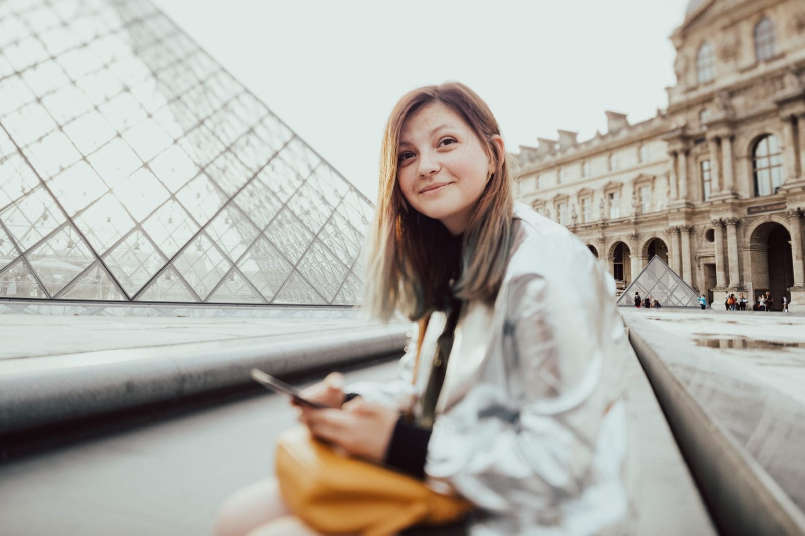 I don’t feel guilty for going on trips without my child woman sitting outside the Lourve