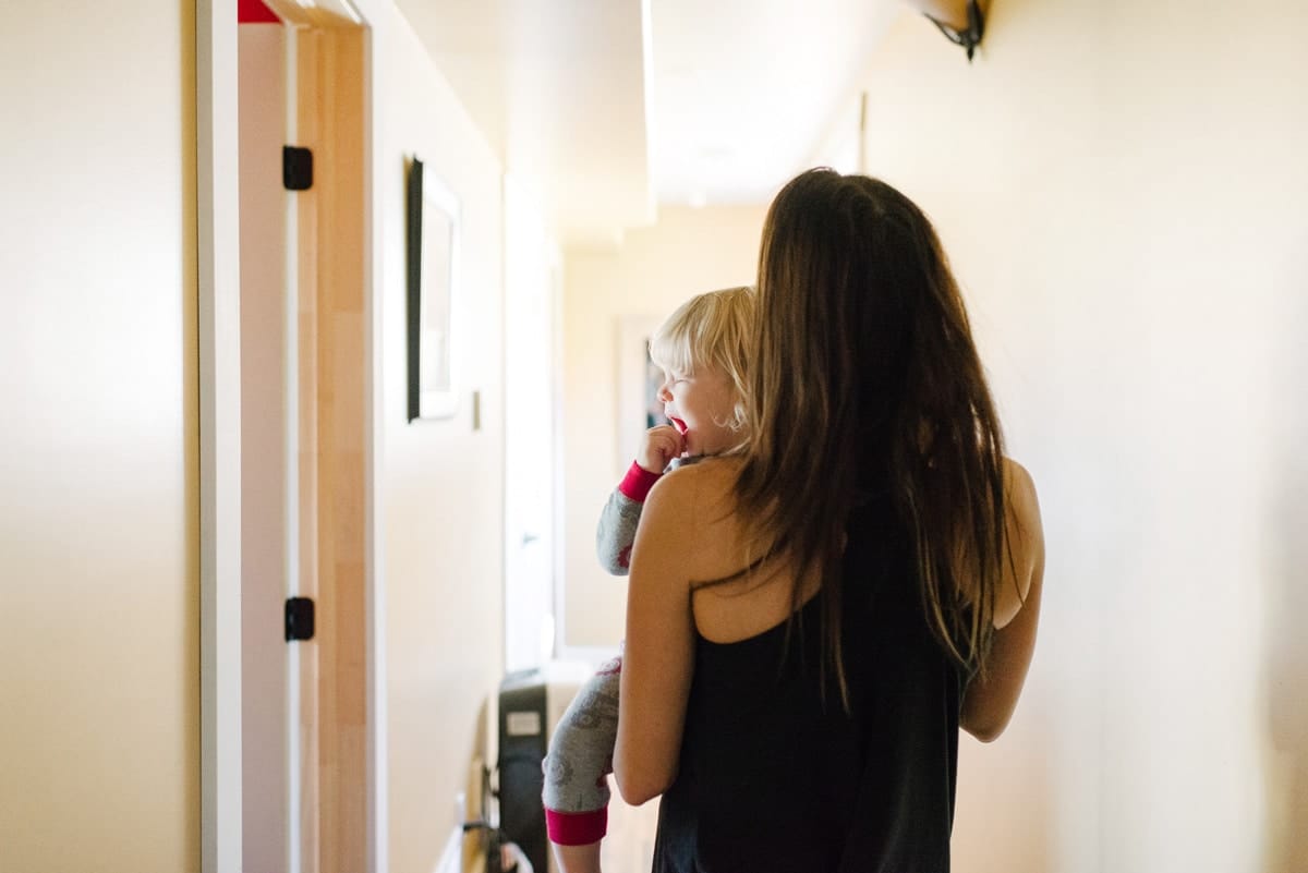 This is what it’s really like to be the spouse of a first responder woman carrying crying toddler