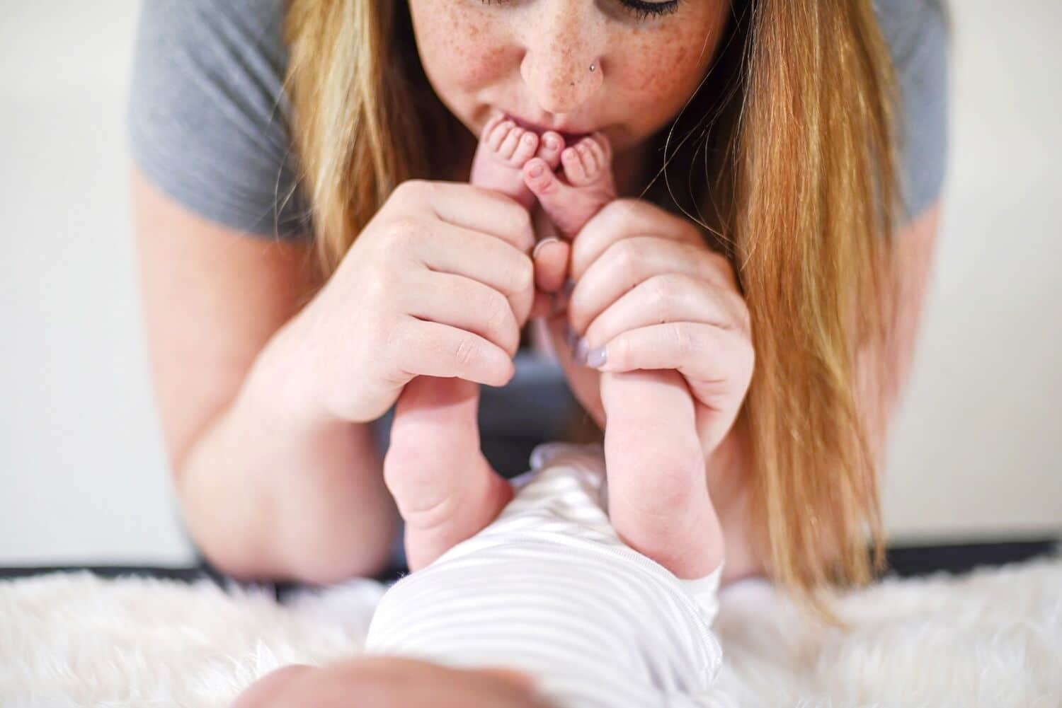 I learned that fed is best when I couldn’t breastfeed my son woman kissing baby's feet