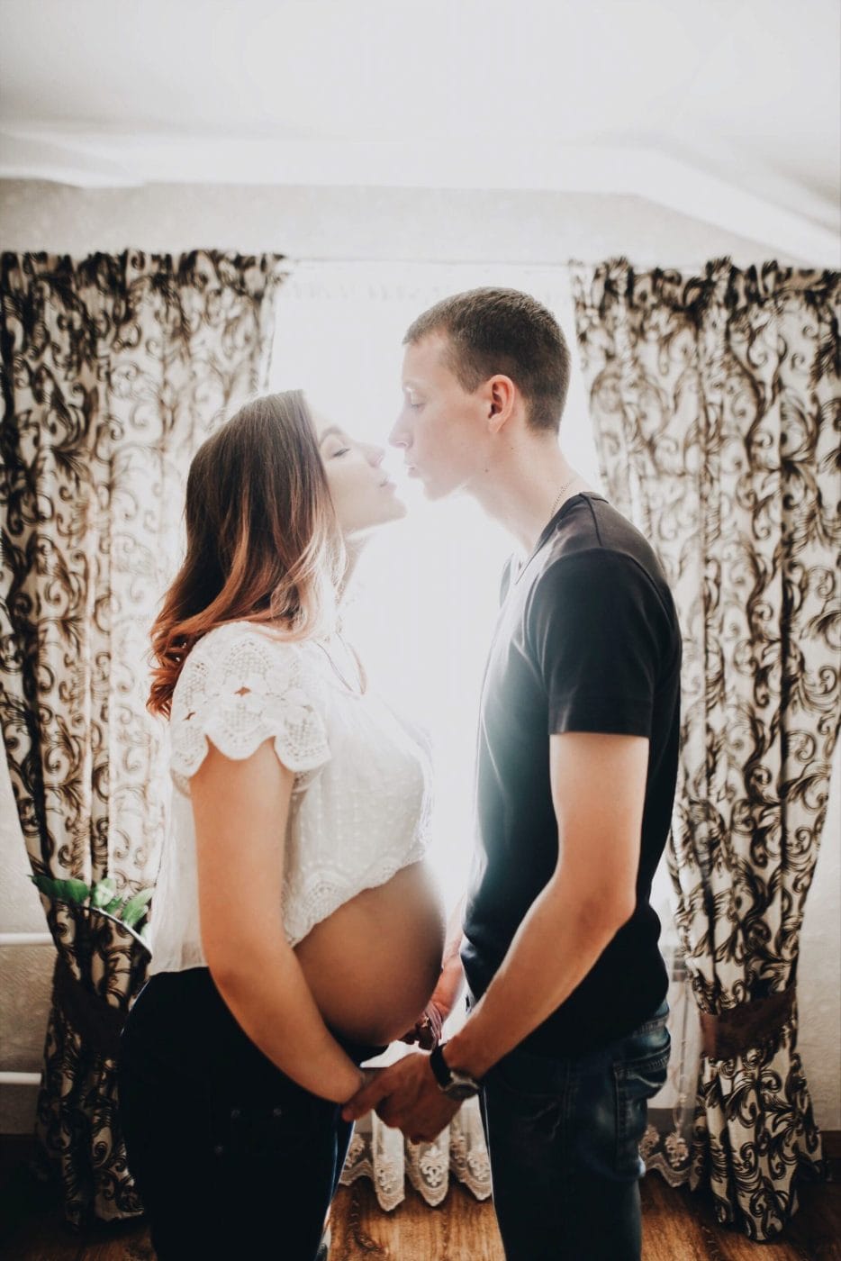 I fall in love with you over and over again pregnant woman kissing her partner